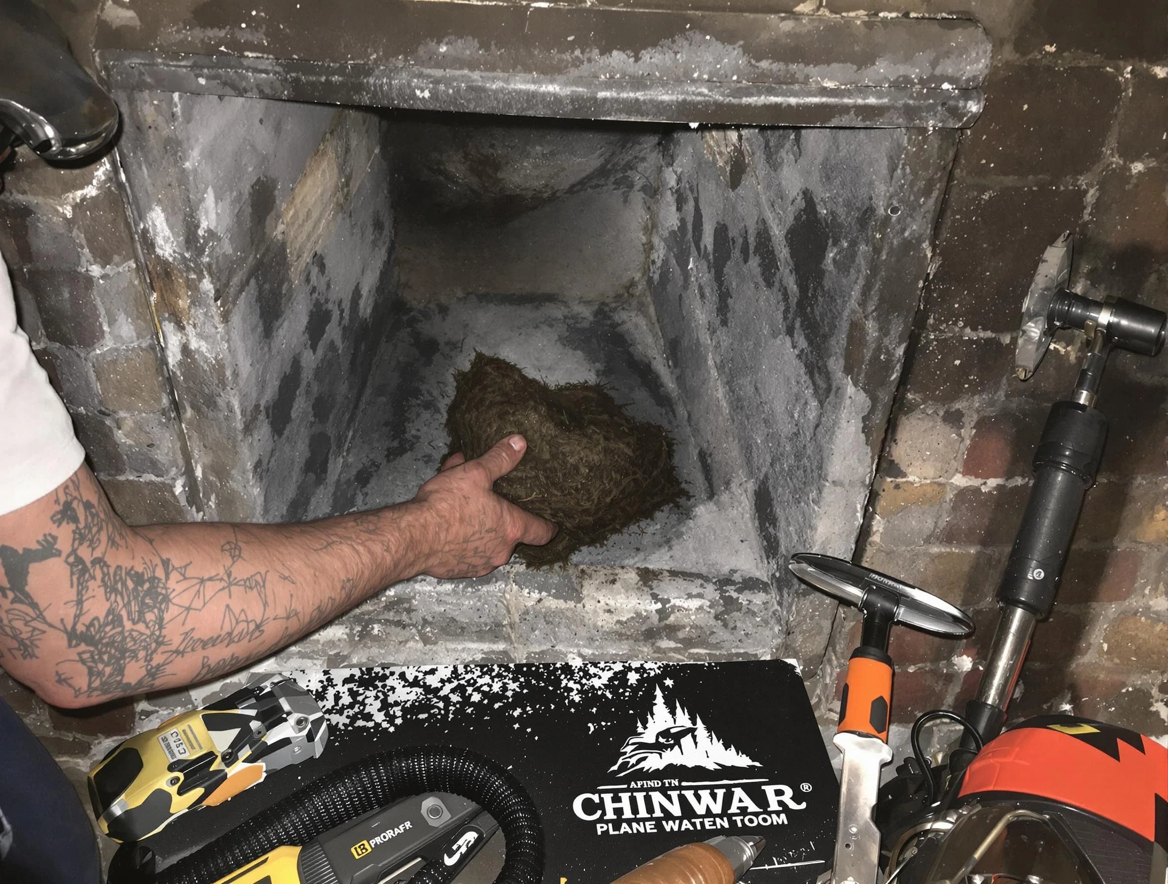 American Fork Chimney Sweep safely removing debris and screening chimney in American Fork, UT